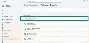 Windows Security settings window with Virus & threat protection option highlighted.